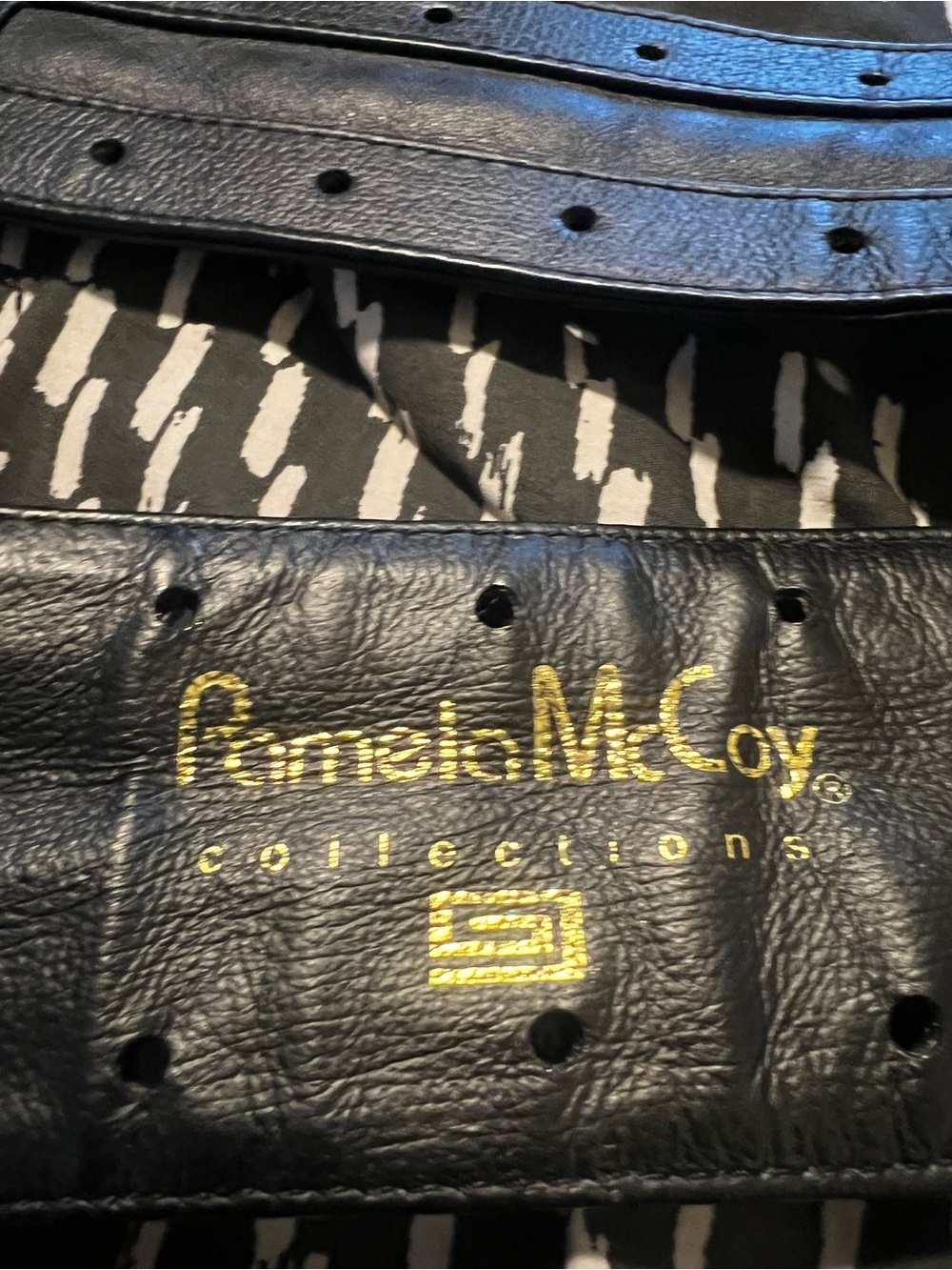 Pamela McCoy Black Leather Belt with Gold Logo Detail